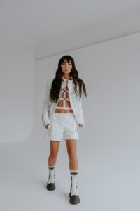 white smooth loose fitting sport soft shorts with elastic waistline