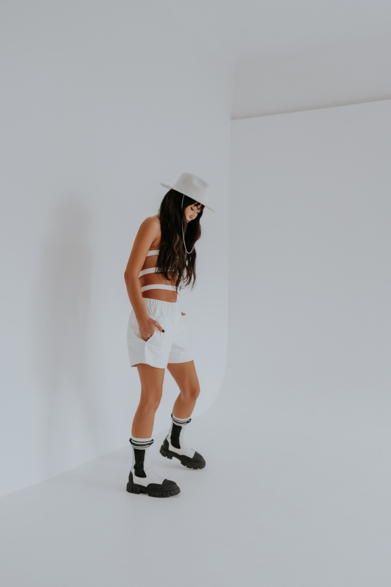 white smooth loose fitting sport soft shorts with elastic waistline